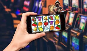 Tampilan antarmuka permainan Ganesha Gold di aplikasi besok 4d dengan gulungan dan simbol keberuntungan